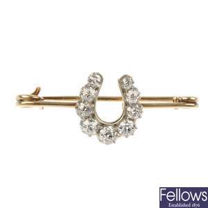 A late 19th century silver and gold diamond horseshoe brooch.