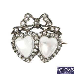 An early 20th century moonstone and diamond twin heart brooch.