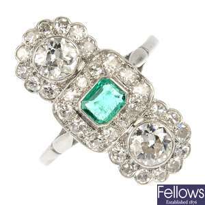 A diamond and emerald dress ring. 