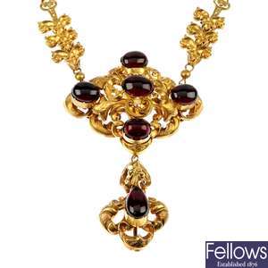 A late 19th century gold garnet necklace.