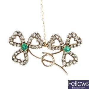 An early 20th century gold emerald and diamond brooch.