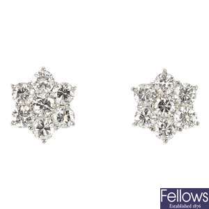 A pair of 18ct gold diamond cluster floral ear studs.