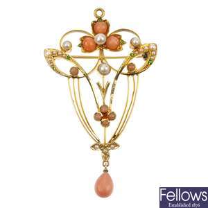 An early 20th century 15ct gold coral, seed pearl and garnet brooch.