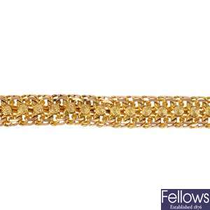 A fancy-link gold bracelet.