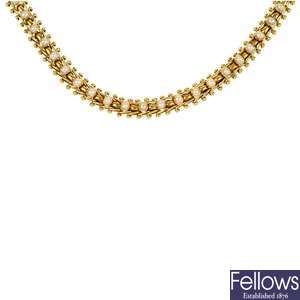 A late 19th century gold split pearl necklace.