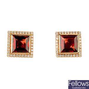 A pair of garnet and diamond cluster ear studs.