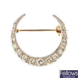 A 9ct gold diamond crescent brooch.