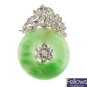 A jade and diamond brooch.