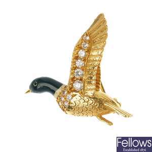 E WOLFE & CO. - an 18ct gold diamond and enamel duck brooch.
