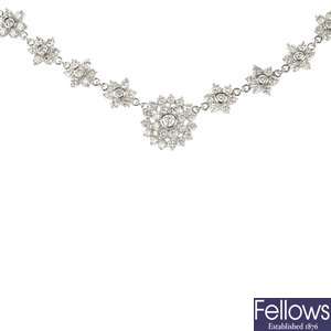 An 18ct gold diamond cluster necklace.