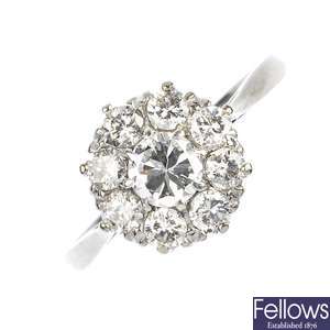 A mid 20th century platinum and 18ct gold diamond cluster ring.