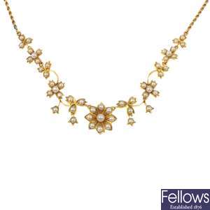 An early 20th century gold split pearl floral necklace.