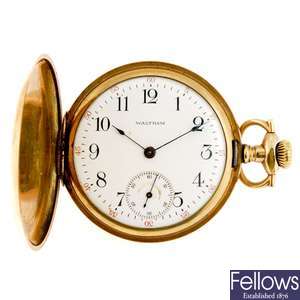 A gold plated keyless wind full hunter pocket watch by Waltham with a open face pocket watch.