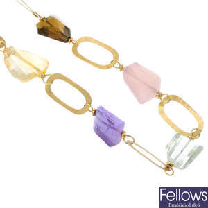 An 18ct gold topaz, citrine, amethyst and quartz necklace. 