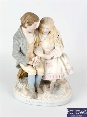 A tinted Parian ware figure group modelled as a young courting couple