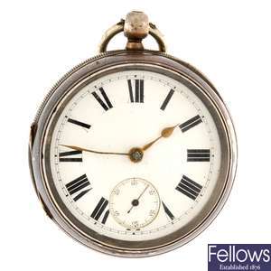 A silver key wind open face pocket watch by W.H Jolly with silver chain.