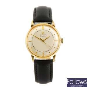 An 18k gold bumper automatic gentleman's Omega wrist watch.