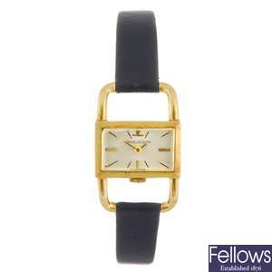 An 18k gold manual wind lady's Jaeger-leCoultre Etrier wrist watch.