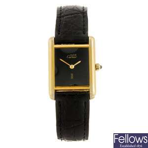 A gold plated silver quartz Must de Cartier wrist watch.