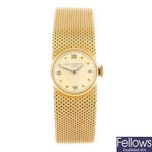 An 18ct gold manual wind lady's Patek Philippe bracelet watch.