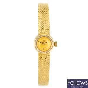 An 18ct gold manual wind lady's Omega bracelet watch.