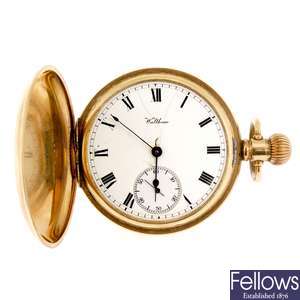 A gold plated keyless wind full hunter pocket watch by Waltham with two similar watches.