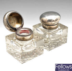 A pair of early 20th century silver mounted glass ink bottles.