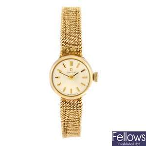 LOT:143 (407033767) A yellow metal quartz lady's Duward King bracelet  watch.