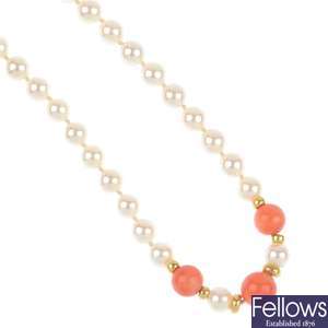 A treated jade necklace and a cultured pearl and coral necklace.