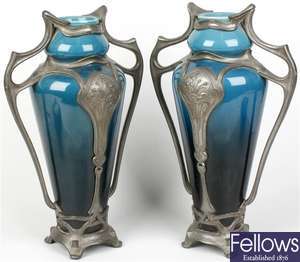 A pair of Continental Art Nouveau pewter-mounted pottery vases