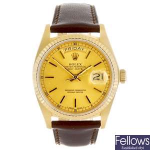 An 18k gold gentleman's Rolex Oyster Perpetual Day Date wrist watch.