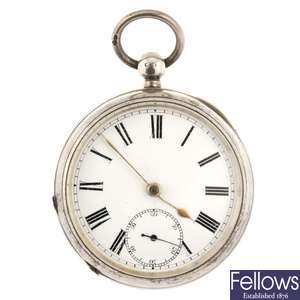 A silver key wind open face pocket watch with chain.