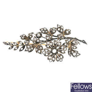 An early 20th century continental silver and gold diamond floral spray brooch.