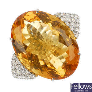 An 18ct gold citrine and diamond ring.