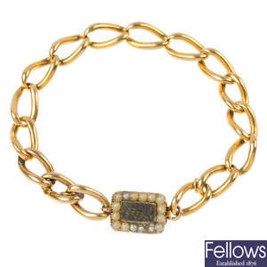 A 9ct gold bracelet with late 19th century sentimental clasp.