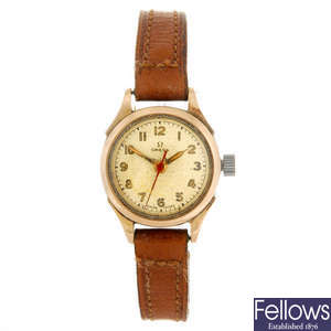 OMEGA - a lady's bi-colour wrist watch.