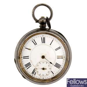 A continental white metal key wind open face pocket watch with another pocket watch.