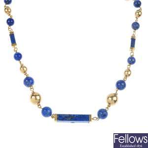 A lapis lazuli necklace and a cultured pearl necklace.