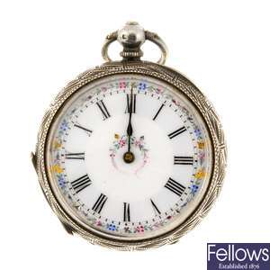 A silver key wind open face pocket watch with a continental metal pocket watch.