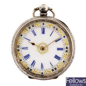 A continental white metal key wind pocket watch with a base metal trench style watch head.