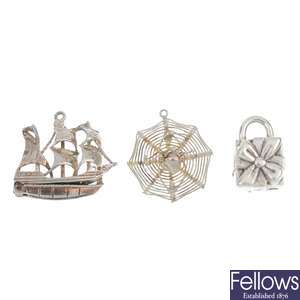 A selection of silver and white metal charms.