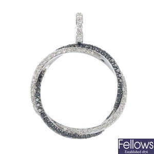 An 18ct gold diamond and black gem pendant.