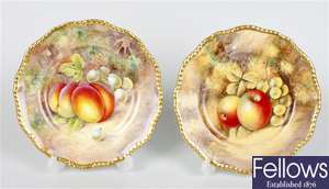 A pair of Royal Worcester fruit painted porcelain side plates