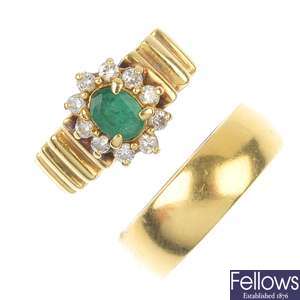 An 18ct gold band ring and an emerald and diamond cluster ring.