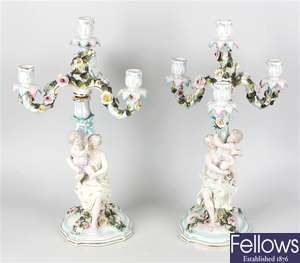 A pair of German figural porcelain candelabra