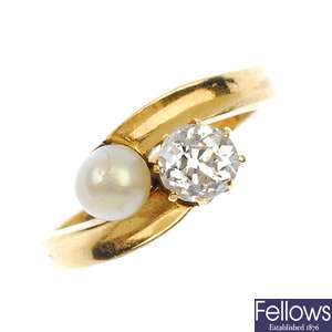 An early 20th century 18ct gold diamond and cultured pearl crossover ring. 
