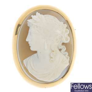 A gold mounted hardstone cameo brooch and cameo ear pendants.