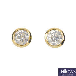 A pair of diamond single-stone ear studs. 