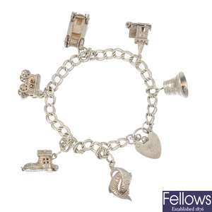 Two charm bracelets and four loose charms.