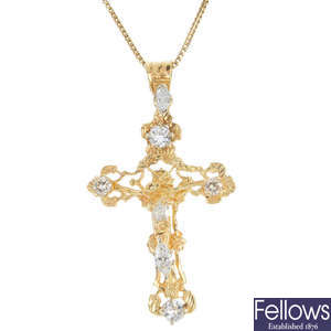 A diamond crucifix pendant.
